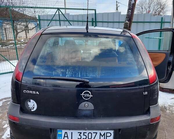 Черный Опель Корса, объемом двигателя 1.2 л и пробегом 140 тыс. км за 3200 $, фото 2 на Automoto.ua