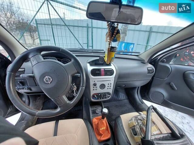 Черный Опель Корса, объемом двигателя 1.2 л и пробегом 140 тыс. км за 3200 $, фото 10 на Automoto.ua
