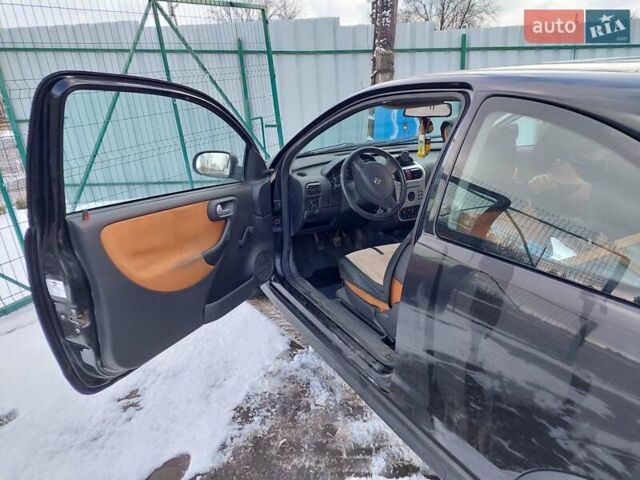 Черный Опель Корса, объемом двигателя 1.2 л и пробегом 140 тыс. км за 3200 $, фото 7 на Automoto.ua
