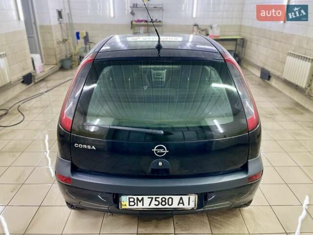 Черный Опель Корса, объемом двигателя 0.97 л и пробегом 260 тыс. км за 2999 $, фото 12 на Automoto.ua