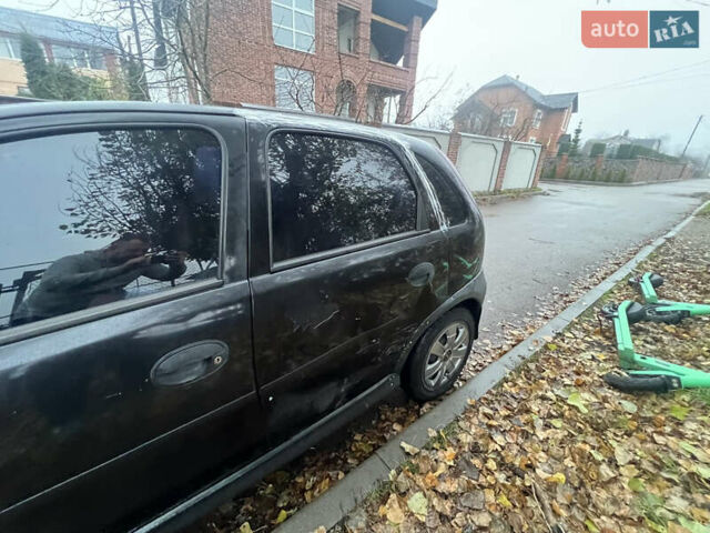 Черный Опель Корса, объемом двигателя 1.39 л и пробегом 280 тыс. км за 2200 $, фото 5 на Automoto.ua