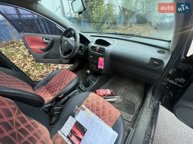 Черный Опель Корса, объемом двигателя 1.39 л и пробегом 280 тыс. км за 2200 $, фото 7 на Automoto.ua