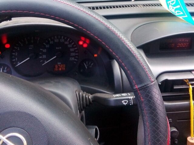 Черный Опель Корса, объемом двигателя 1.4 л и пробегом 360 тыс. км за 2500 $, фото 2 на Automoto.ua