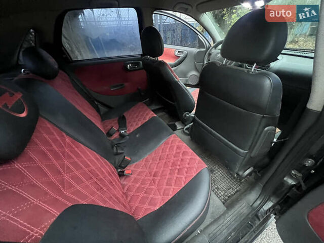 Черный Опель Корса, объемом двигателя 1.39 л и пробегом 280 тыс. км за 2200 $, фото 8 на Automoto.ua