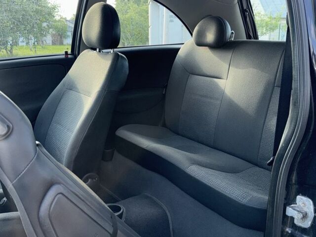 Черный Опель Корса, объемом двигателя 1 л и пробегом 140 тыс. км за 2300 $, фото 8 на Automoto.ua