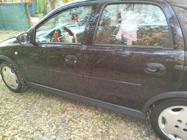 Черный Опель Корса, объемом двигателя 1.2 л и пробегом 220 тыс. км за 3600 $, фото 6 на Automoto.ua