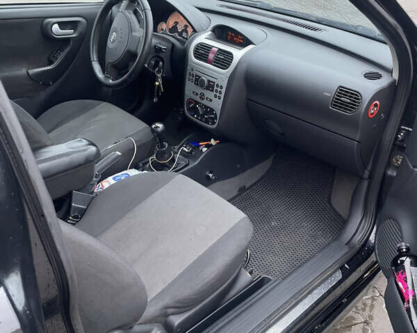 Чорний Опель Корса, об'ємом двигуна 1.2 л та пробігом 240 тис. км за 2800 $, фото 5 на Automoto.ua