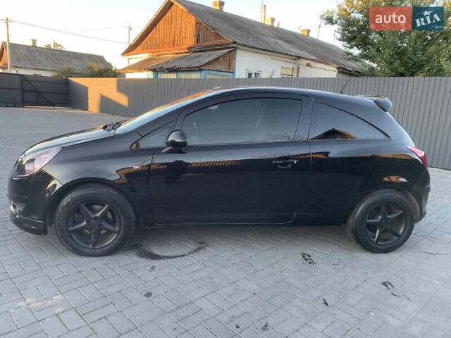Черный Опель Корса, объемом двигателя 1.3 л и пробегом 265 тыс. км за 4200 $, фото 3 на Automoto.ua