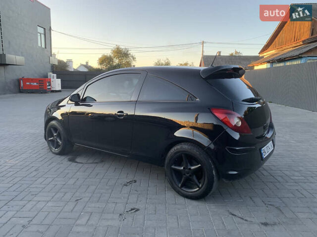 Черный Опель Корса, объемом двигателя 1.3 л и пробегом 265 тыс. км за 4200 $, фото 5 на Automoto.ua