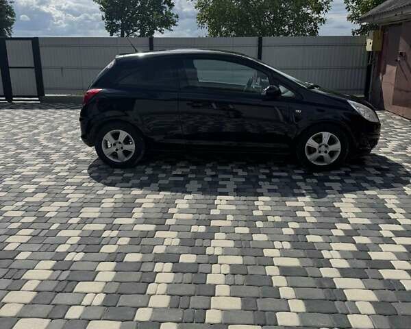Черный Опель Корса, объемом двигателя 1.23 л и пробегом 230 тыс. км за 4300 $, фото 6 на Automoto.ua