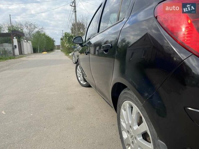 Черный Опель Корса, объемом двигателя 1.23 л и пробегом 207 тыс. км за 5200 $, фото 5 на Automoto.ua