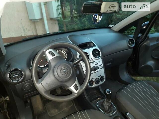 Черный Опель Корса, объемом двигателя 1 л и пробегом 225 тыс. км за 4700 $, фото 29 на Automoto.ua