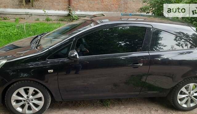Черный Опель Корса, объемом двигателя 1 л и пробегом 225 тыс. км за 4700 $, фото 12 на Automoto.ua