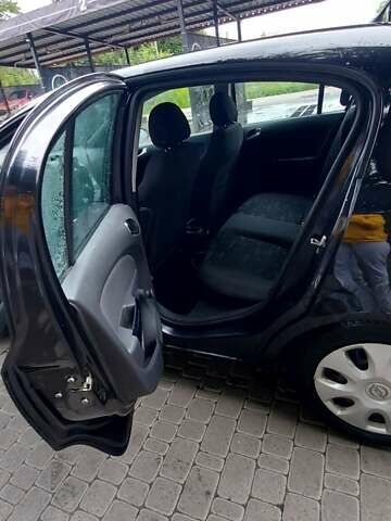 Черный Опель Корса, объемом двигателя 1.25 л и пробегом 218 тыс. км за 5800 $, фото 3 на Automoto.ua