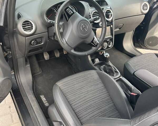 Черный Опель Корса, объемом двигателя 1.2 л и пробегом 125 тыс. км за 6200 $, фото 7 на Automoto.ua