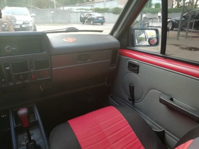 Красный Опель Корса, объемом двигателя 1 л и пробегом 1000 тыс. км за 544 $, фото 6 на Automoto.ua