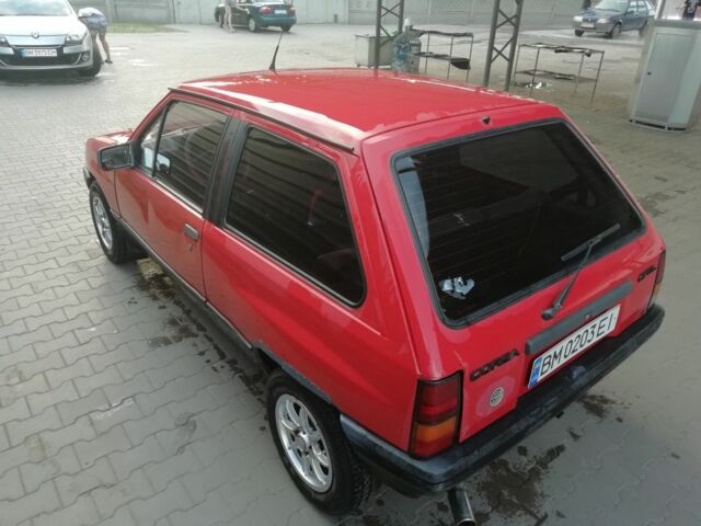 Красный Опель Корса, объемом двигателя 1 л и пробегом 1000 тыс. км за 544 $, фото 7 на Automoto.ua