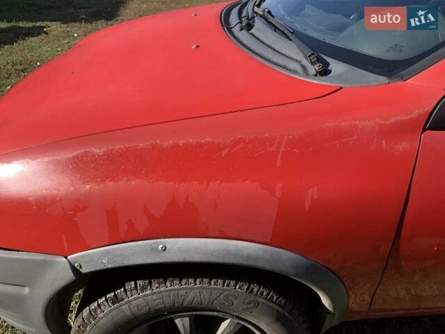 Красный Опель Корса, объемом двигателя 1.2 л и пробегом 285 тыс. км за 1500 $, фото 10 на Automoto.ua