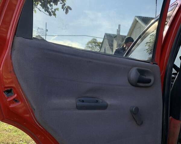 Красный Опель Корса, объемом двигателя 1.2 л и пробегом 285 тыс. км за 1500 $, фото 12 на Automoto.ua