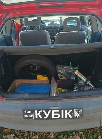 Красный Опель Корса, объемом двигателя 1.2 л и пробегом 222 тыс. км за 1318 $, фото 6 на Automoto.ua