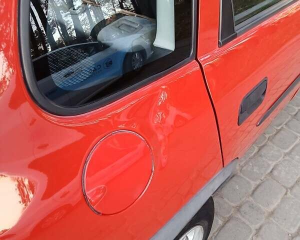 Красный Опель Корса, объемом двигателя 1.2 л и пробегом 130 тыс. км за 2800 $, фото 3 на Automoto.ua