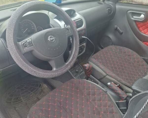Опель Корса 2003 в Каменское - Днепродзержинск на Automoto.ua Красный Опель Корса, объемом двигателя 1 л и пробегом 153 тыс. км за 3200 $, фото 7 на Automoto.ua