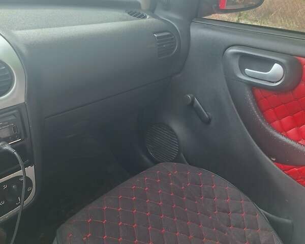 Опель Корса 2003 в Каменское - Днепродзержинск на Automoto.ua Красный Опель Корса, объемом двигателя 1 л и пробегом 153 тыс. км за 3200 $, фото 8 на Automoto.ua