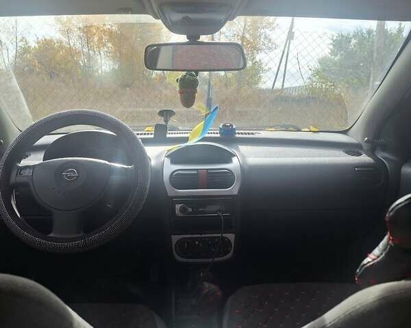 Опель Корса 2003 в Каменское - Днепродзержинск на Automoto.ua Красный Опель Корса, объемом двигателя 1 л и пробегом 153 тыс. км за 3200 $, фото 6 на Automoto.ua