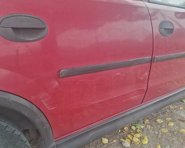 Опель Корса 2003 в Каменское - Днепродзержинск на Automoto.ua Красный Опель Корса, объемом двигателя 1 л и пробегом 153 тыс. км за 3200 $, фото 18 на Automoto.ua
