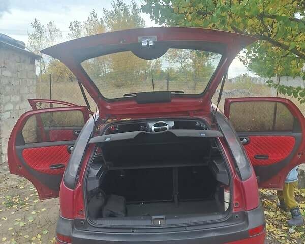 Опель Корса 2003 в Каменское - Днепродзержинск на Automoto.ua Красный Опель Корса, объемом двигателя 1 л и пробегом 153 тыс. км за 3200 $, фото 11 на Automoto.ua