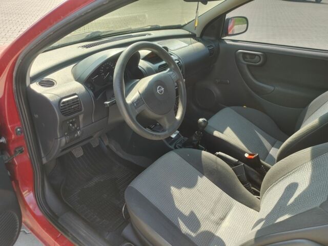 Красный Опель Корса, объемом двигателя 1 л и пробегом 194 тыс. км за 1900 $, фото 19 на Automoto.ua