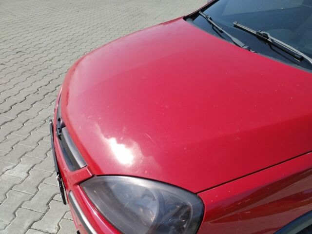 Красный Опель Корса, объемом двигателя 1 л и пробегом 194 тыс. км за 1900 $, фото 2 на Automoto.ua