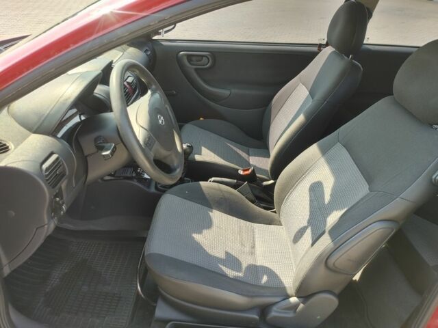 Красный Опель Корса, объемом двигателя 1 л и пробегом 194 тыс. км за 1900 $, фото 18 на Automoto.ua