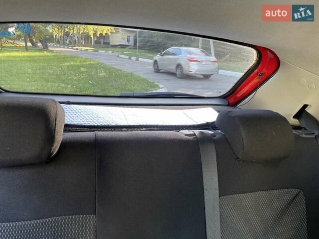 Красный Опель Корса, объемом двигателя 1.23 л и пробегом 135 тыс. км за 6000 $, фото 55 на Automoto.ua