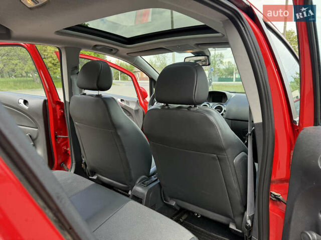 Красный Опель Корса, объемом двигателя 1.23 л и пробегом 127 тыс. км за 6600 $, фото 51 на Automoto.ua