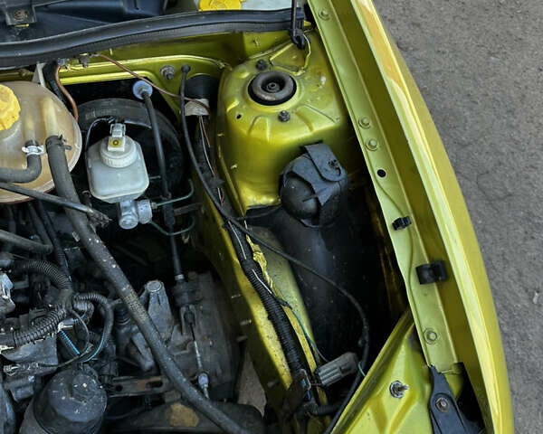 Жовтий Опель Корса, об'ємом двигуна 1 л та пробігом 148 тис. км за 3200 $, фото 11 на Automoto.ua