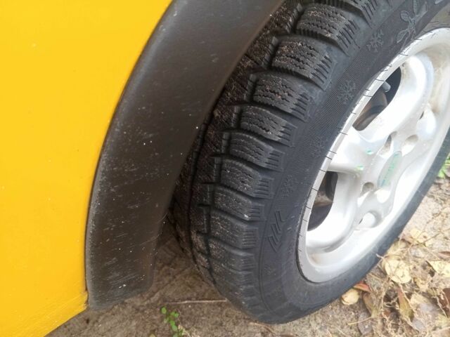 Желтый Опель Корса, объемом двигателя 1 л и пробегом 380 тыс. км за 2500 $, фото 14 на Automoto.ua