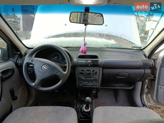 Серый Опель Корса, объемом двигателя 1.2 л и пробегом 220 тыс. км за 550 $, фото 4 на Automoto.ua