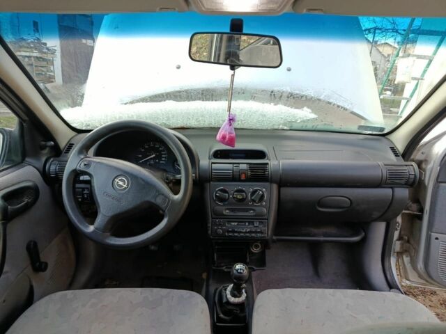 Серый Опель Корса, объемом двигателя 1.2 л и пробегом 220 тыс. км за 550 $, фото 5 на Automoto.ua