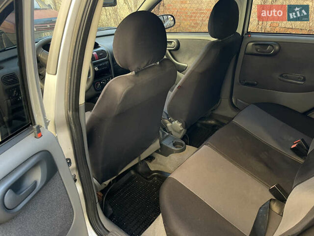 Серый Опель Корса, объемом двигателя 1.2 л и пробегом 220 тыс. км за 2350 $, фото 6 на Automoto.ua