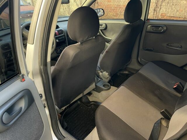 Серый Опель Корса, объемом двигателя 1.2 л и пробегом 200 тыс. км за 2350 $, фото 6 на Automoto.ua