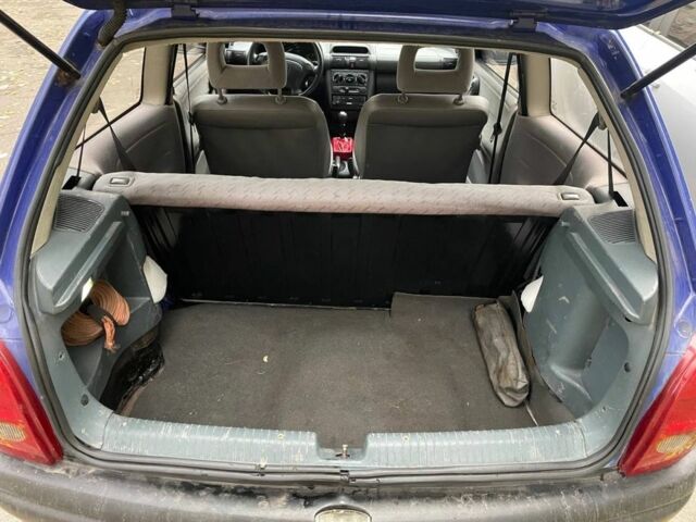 Синий Опель Корса, объемом двигателя 1.2 л и пробегом 290 тыс. км за 1500 $, фото 2 на Automoto.ua