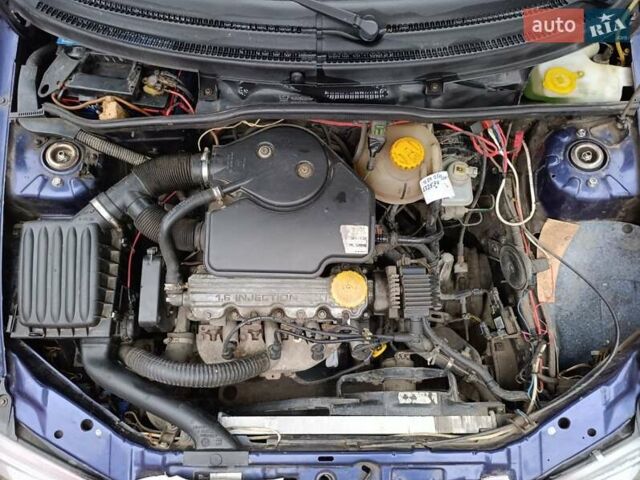 Синий Опель Корса, объемом двигателя 1.2 л и пробегом 200 тыс. км за 1800 $, фото 11 на Automoto.ua