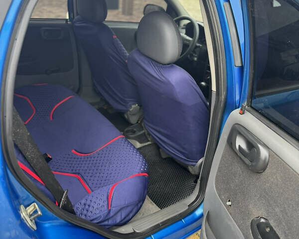 Синий Опель Корса, объемом двигателя 1.2 л и пробегом 200 тыс. км за 2200 $, фото 7 на Automoto.ua