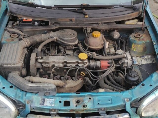 Зеленый Опель Корса, объемом двигателя 1.4 л и пробегом 314 тыс. км за 1300 $, фото 4 на Automoto.ua