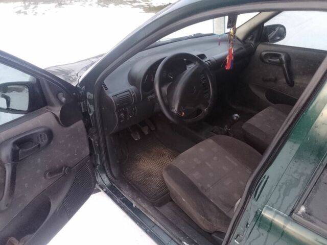 Зеленый Опель Корса, объемом двигателя 1 л и пробегом 200 тыс. км за 1500 $, фото 4 на Automoto.ua