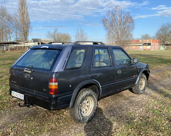 Черный Опель Фронтера, объемом двигателя 2.3 л и пробегом 287 тыс. км за 2750 $, фото 2 на Automoto.ua