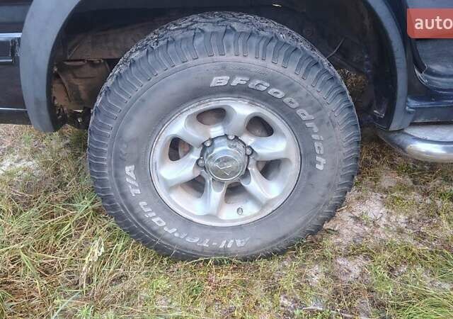 Черный Опель Фронтера, объемом двигателя 2.4 л и пробегом 319 тыс. км за 4300 $, фото 4 на Automoto.ua