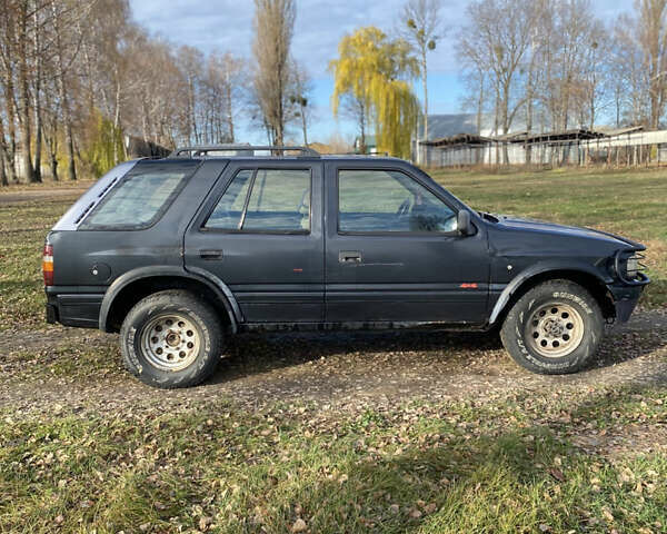 Черный Опель Фронтера, объемом двигателя 2.3 л и пробегом 287 тыс. км за 2750 $, фото 1 на Automoto.ua