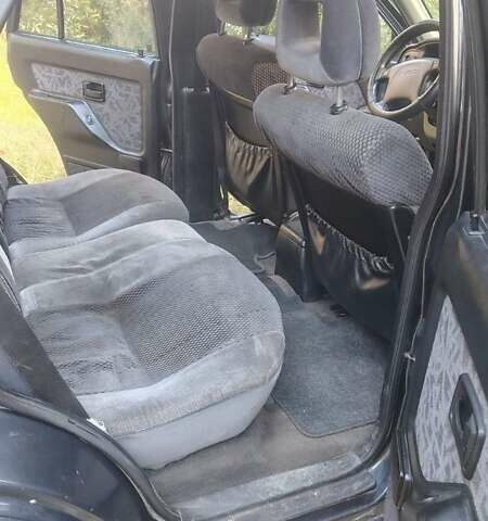 Черный Опель Фронтера, объемом двигателя 2.4 л и пробегом 319 тыс. км за 4300 $, фото 1 на Automoto.ua